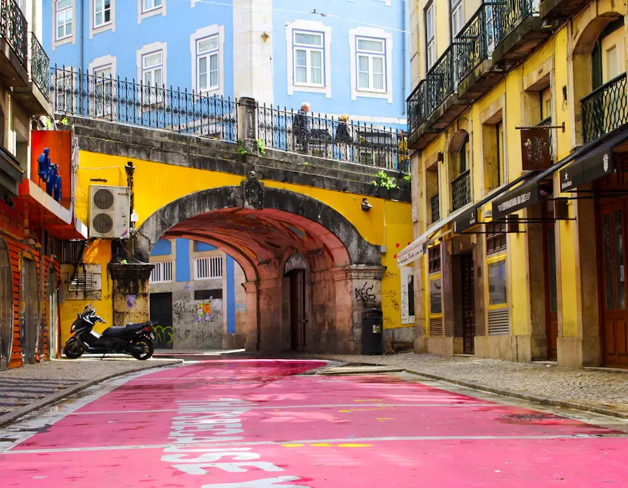 Colourful tiled buildings and a painted street in Lisbon
